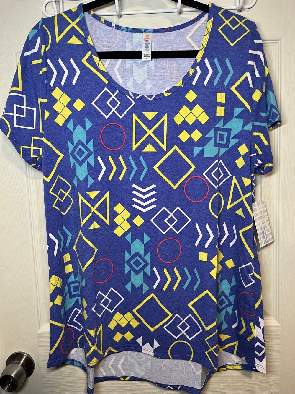 LuLaRoe Short Sleeve Tee in Blue with Yellow, Teal & Red Geometric Print